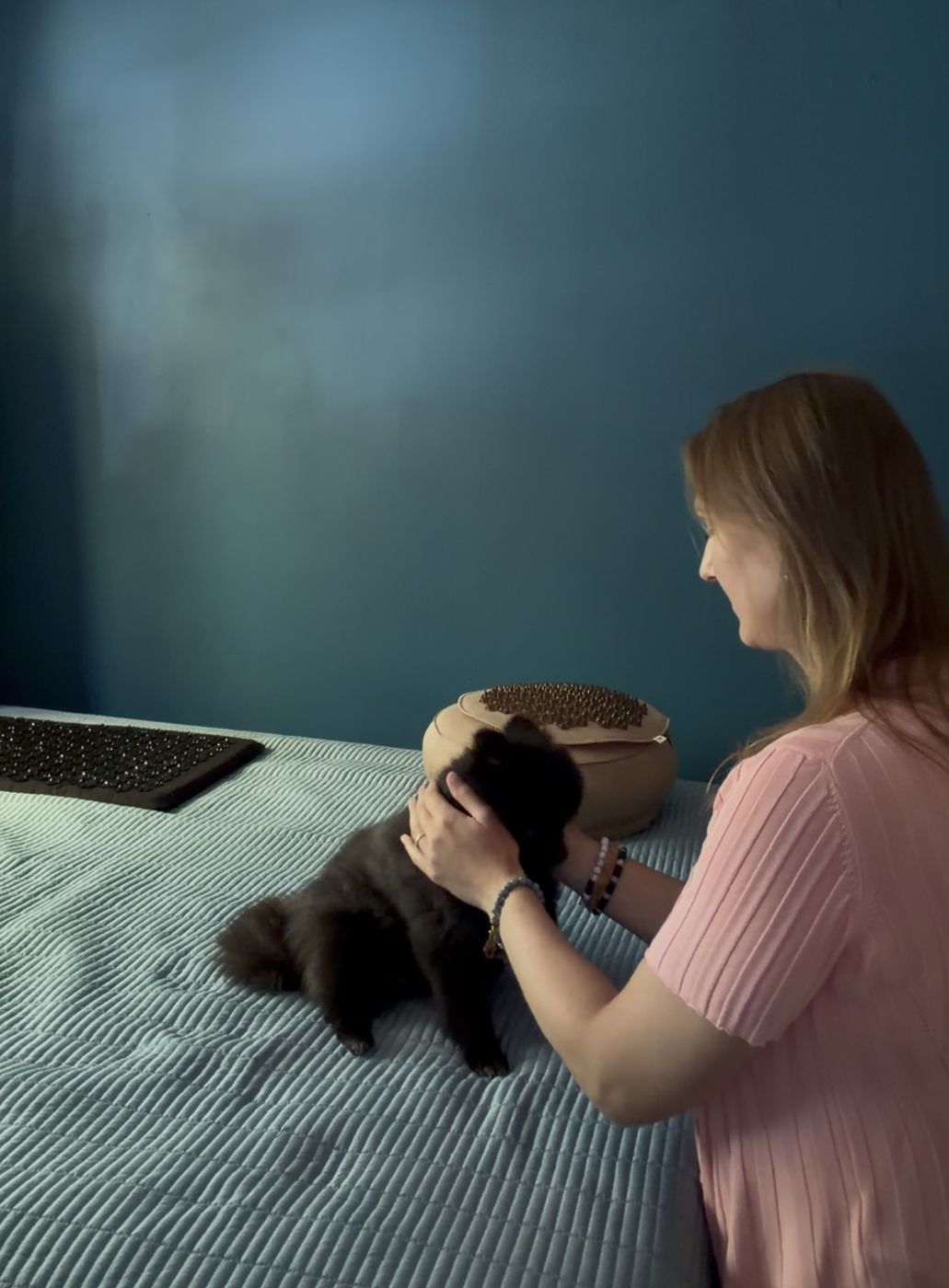 Anna giving Reiki to her Pomeranian dog